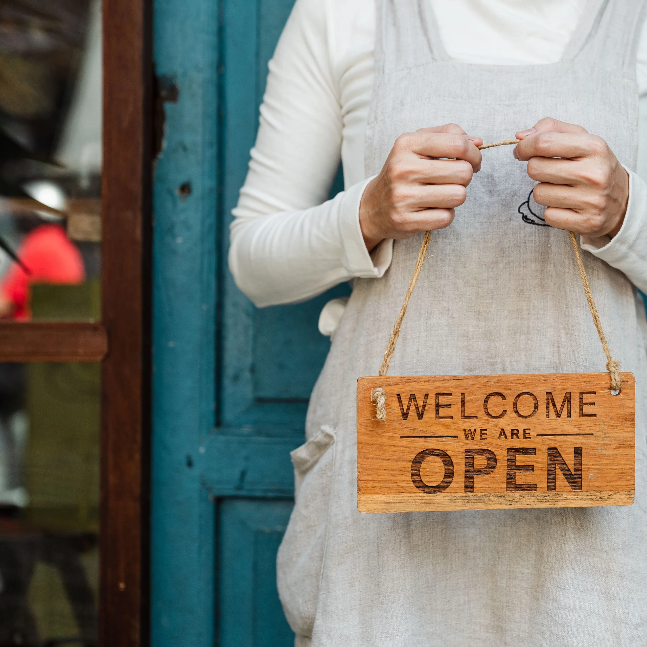 Owner welcoming customers