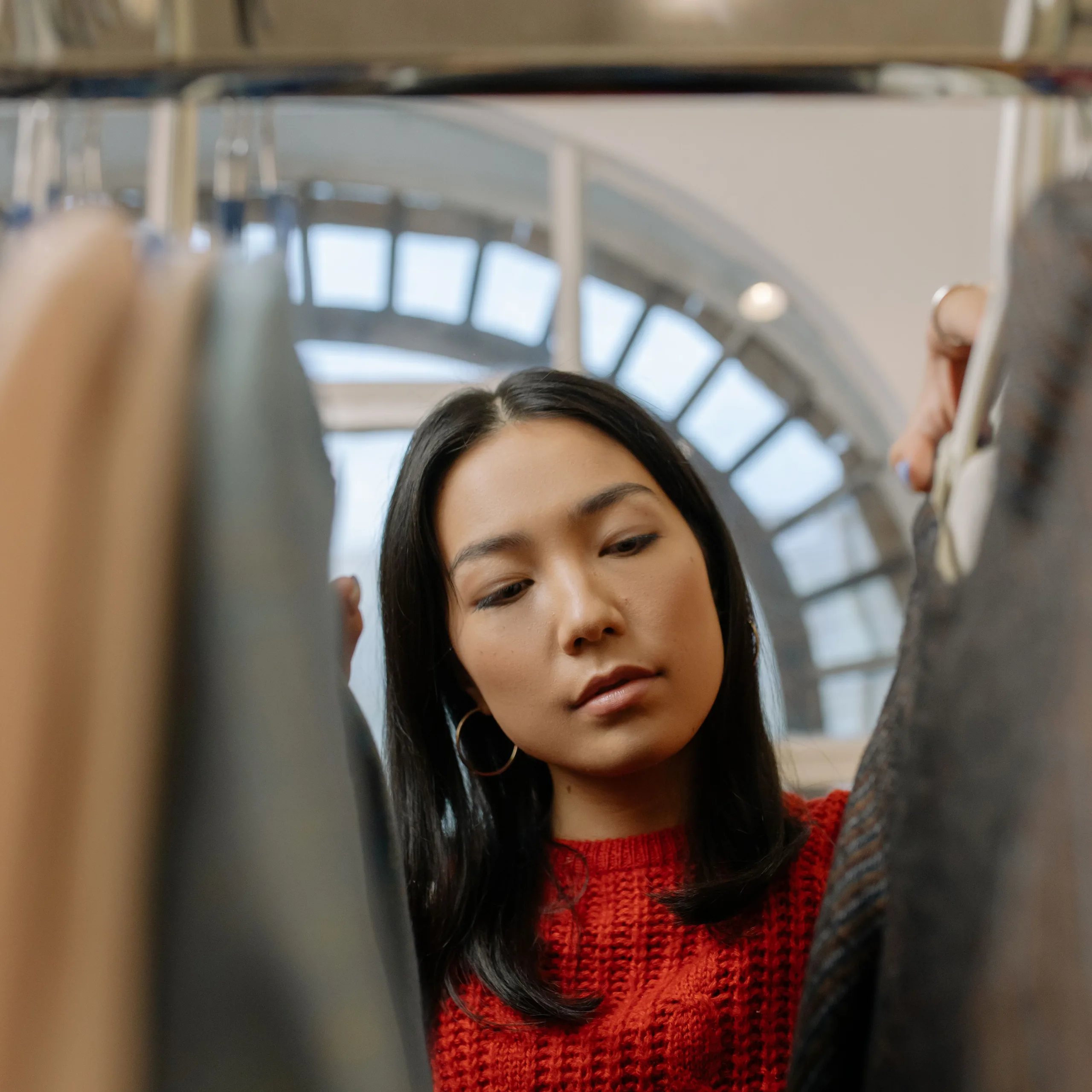 Customer browsing a clothes rack