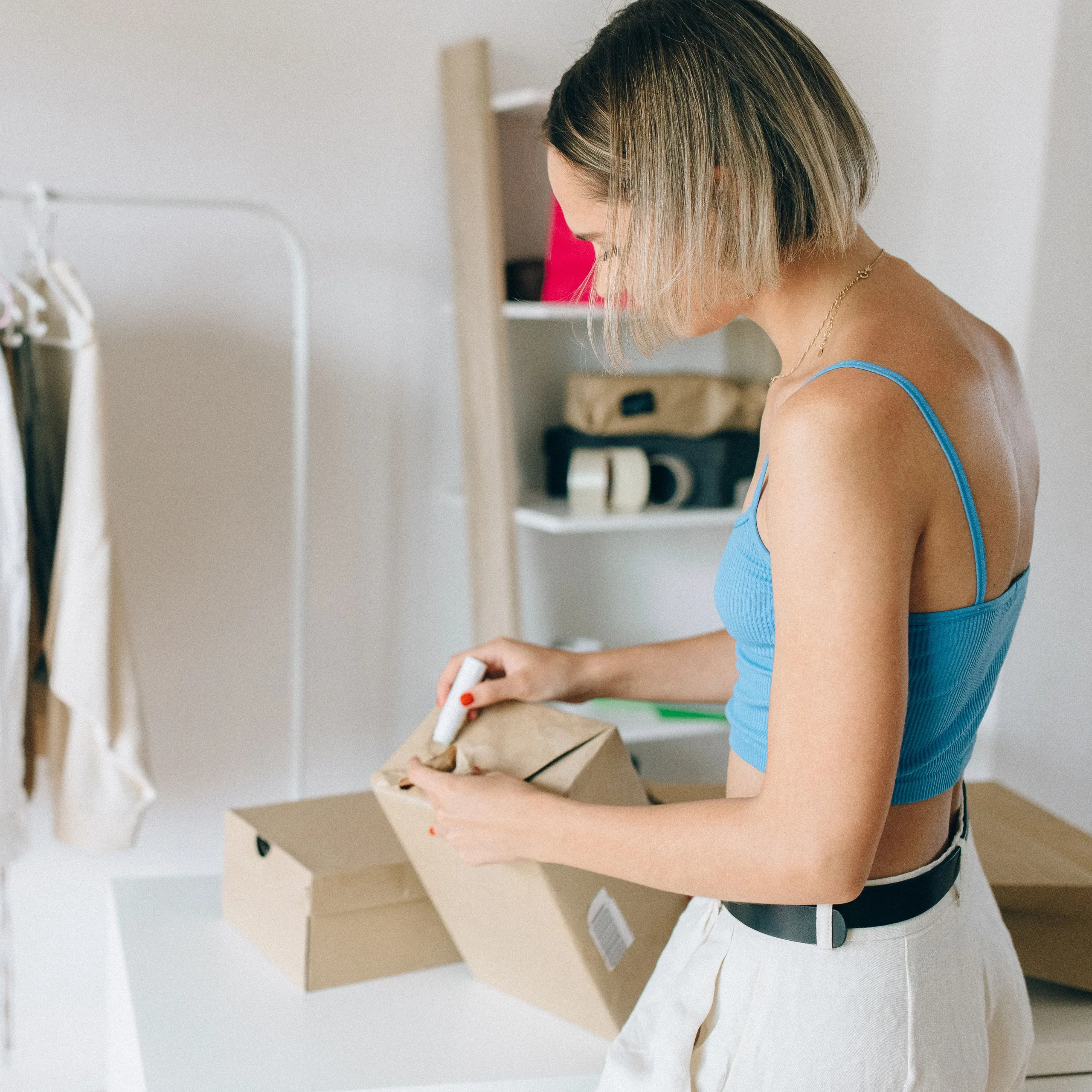 Online seller packing an order
